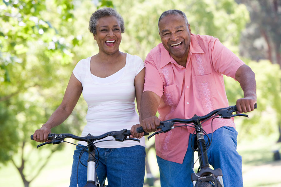 retired couple biking